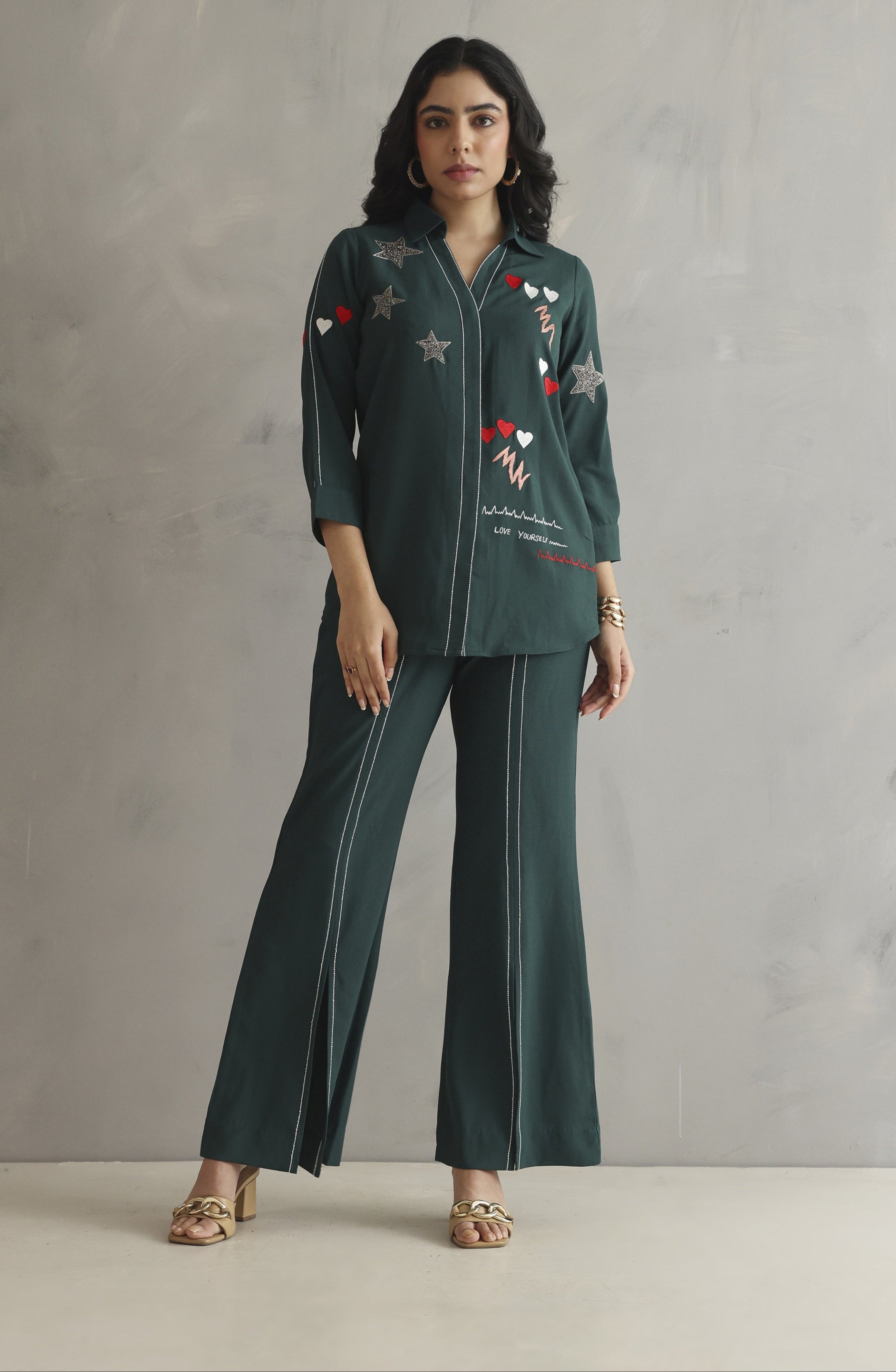 Bottle green co-ord set featuring colorful embroidery with a heartbeat motif