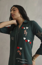 Bottle green co-ord set featuring colorful embroidery with a heartbeat motif