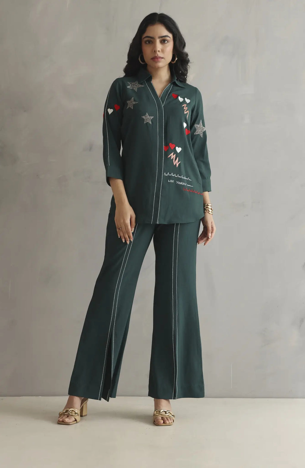 Bottle green co-ord set featuring colorful embroidery with a heartbeat motif