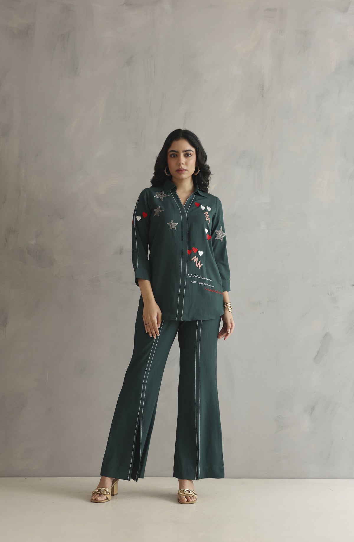 Bottle green co-ord set featuring colorful embroidery with a heartbeat motif